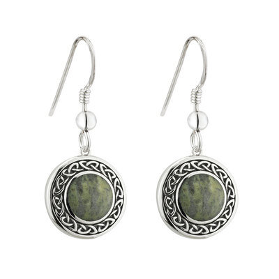 A pair of earrings with green stones on them.