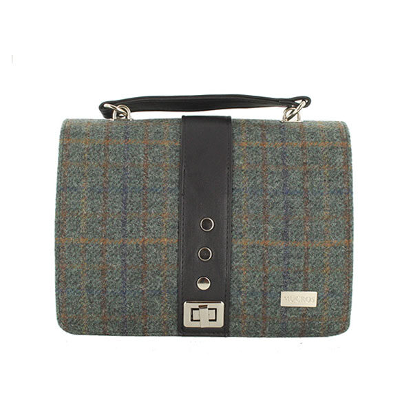 A bag that is made of wool and leather.