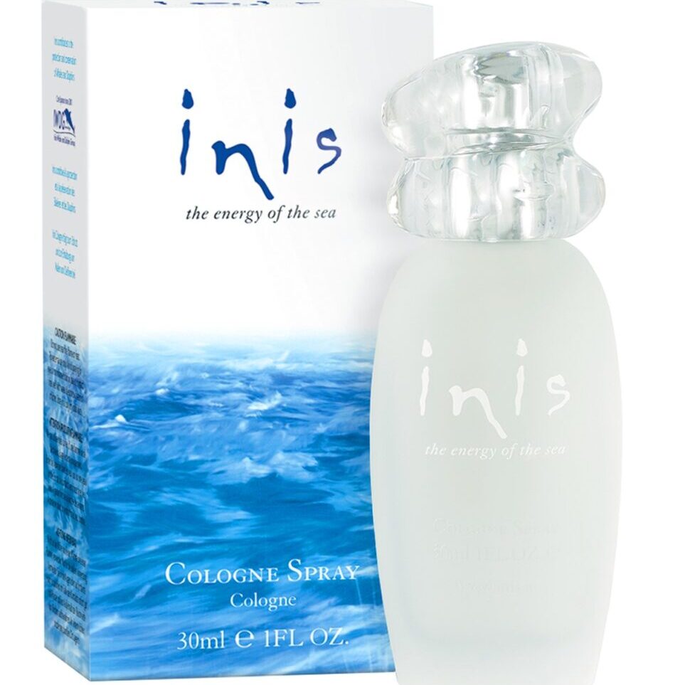 A bottle of inis cologne spray next to its box.