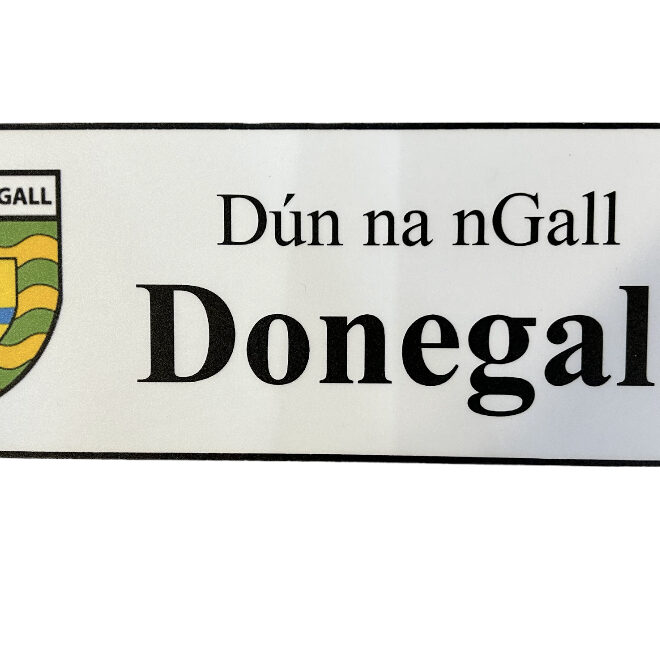 A white sign with the name of donegal on it.