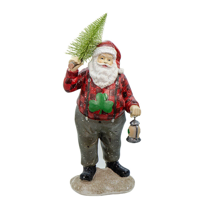 A santa claus figurine holding a pine tree.