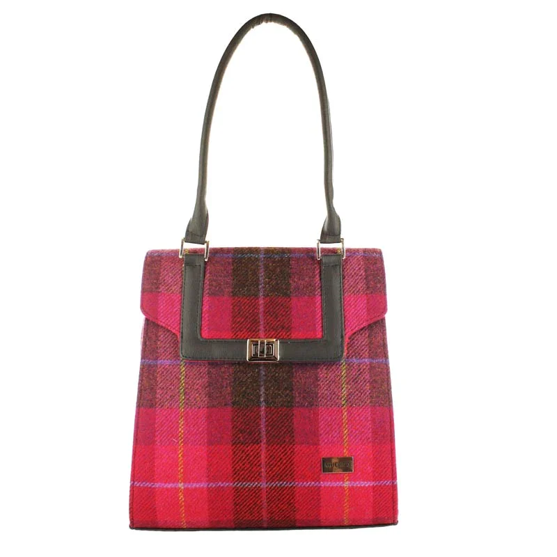 A red plaid bag with a leather handle.