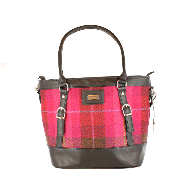 A pink plaid purse with brown leather straps.