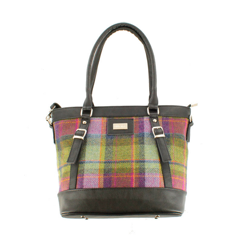 A plaid purse with black leather handles and a strap.
