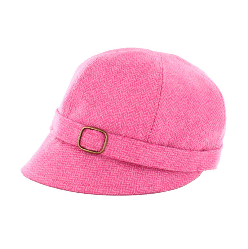 A pink hat with a buckle on top of it.