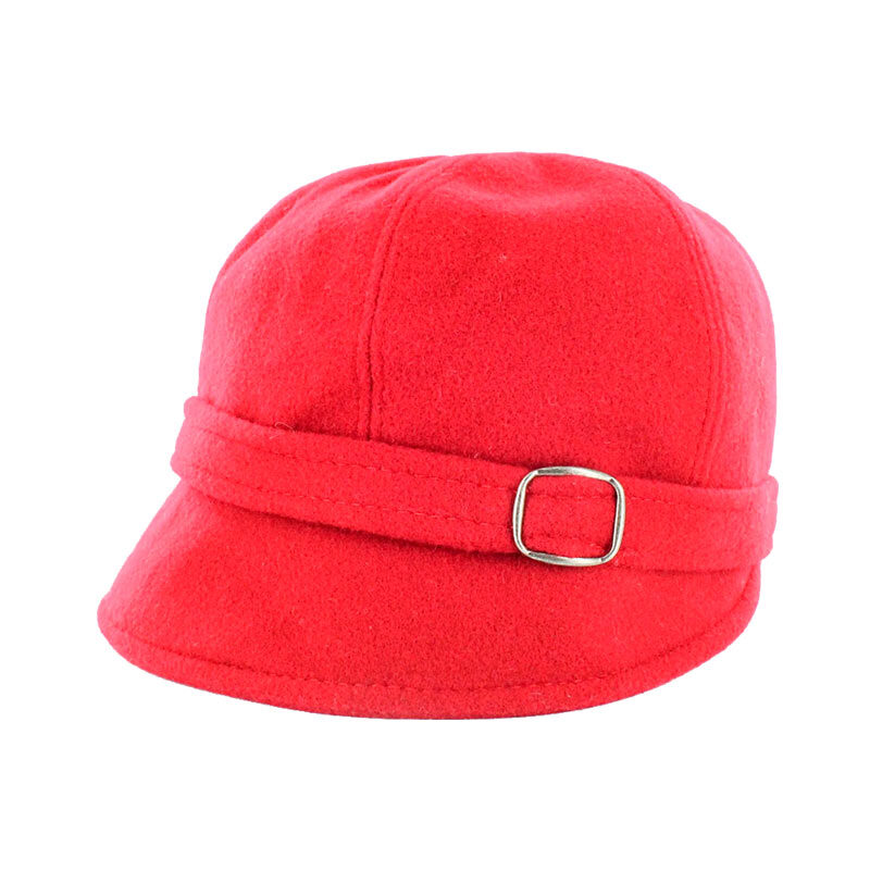 A red hat with a gold buckle on top of it.