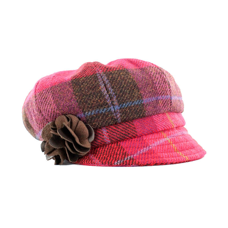 A pink plaid hat with a flower on top of it.