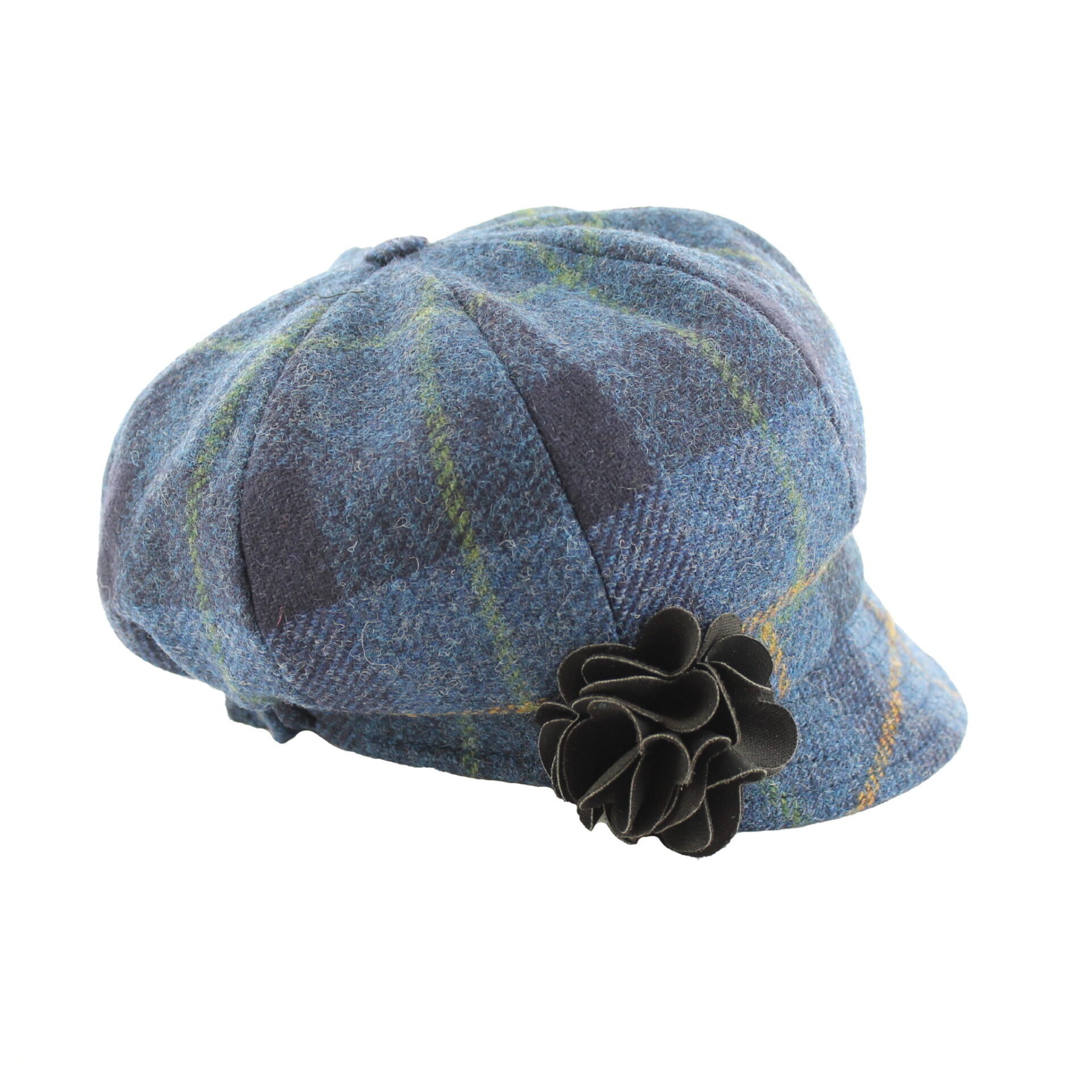 A blue hat with a flower on the side of it.