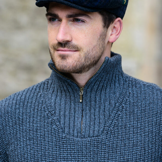 A man wearing a sweater and hat.