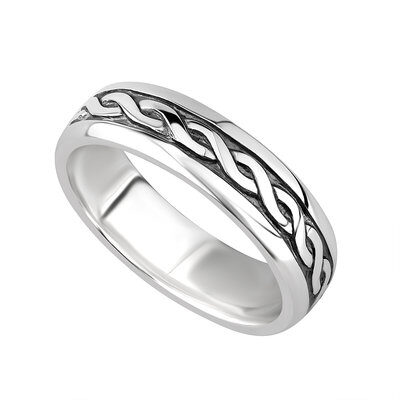 A silver ring with a celtic design on it.