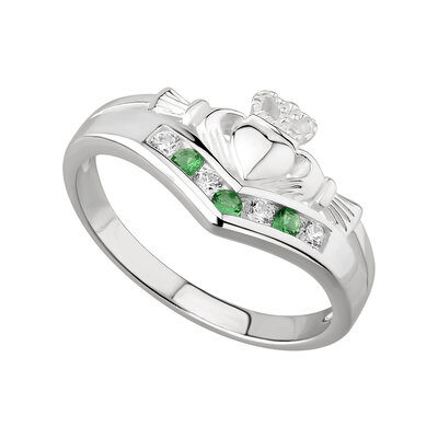 A claddagh ring with green and white stones.