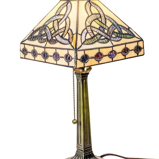 A lamp that is sitting on the floor.